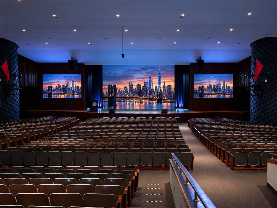 Auditorium with synchronized AV projection screens